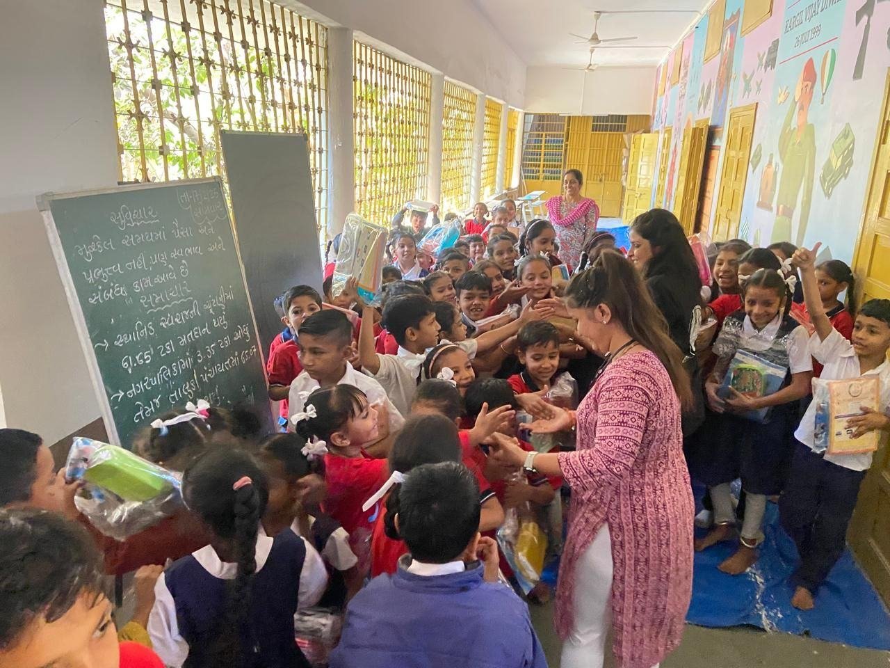 A girl smiling with her new school kit