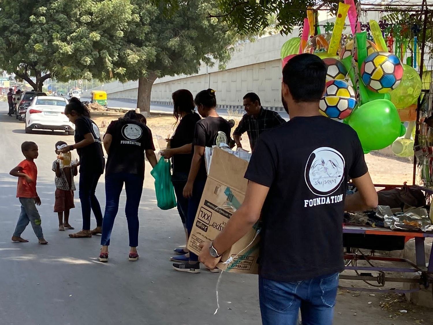 Volunteers distributing toys during the festival drive