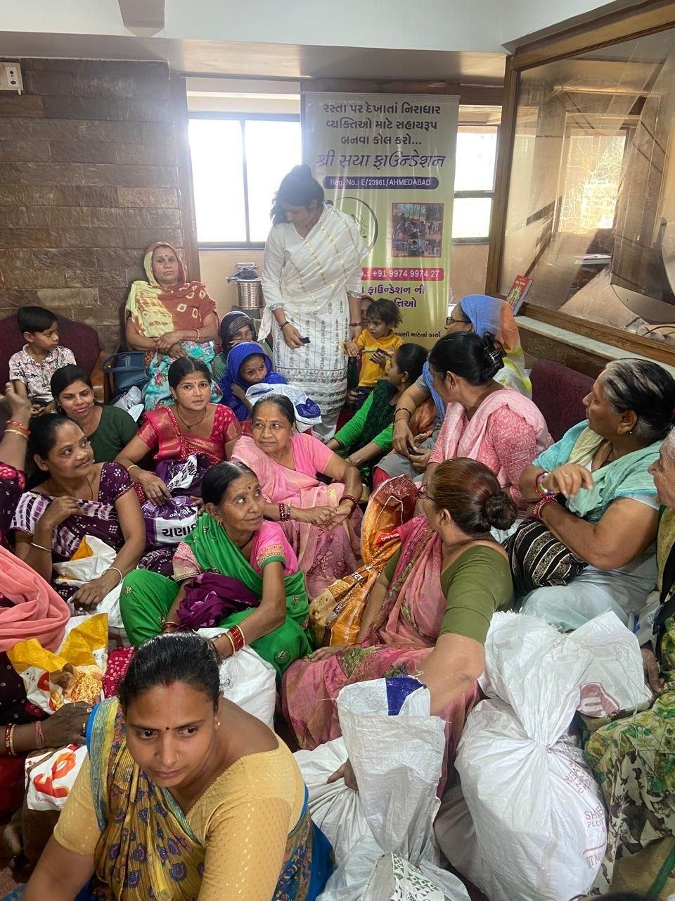 Elderly women receiving monthly ration kits