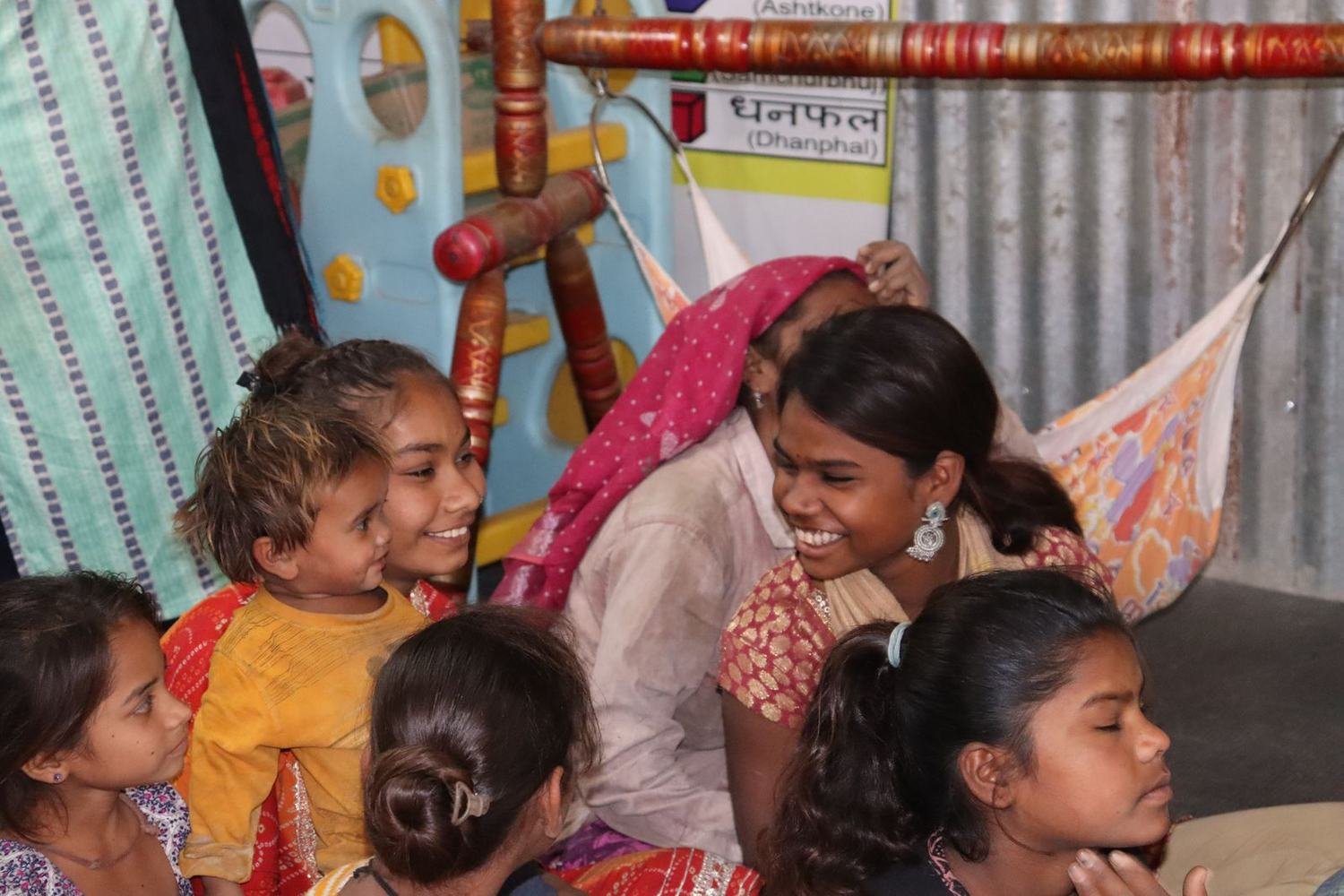 Children receiving new blankets during the winter donation drive